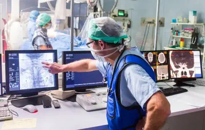 Mechanical thrombectomy procedure on a patient with symptoms of stroke as observed from the control room.